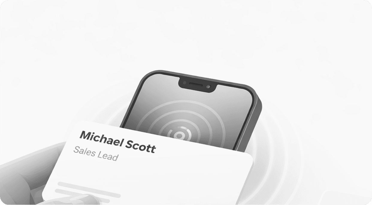 Hand holding NFC card near phone — Michael Scott, Sales Lead
